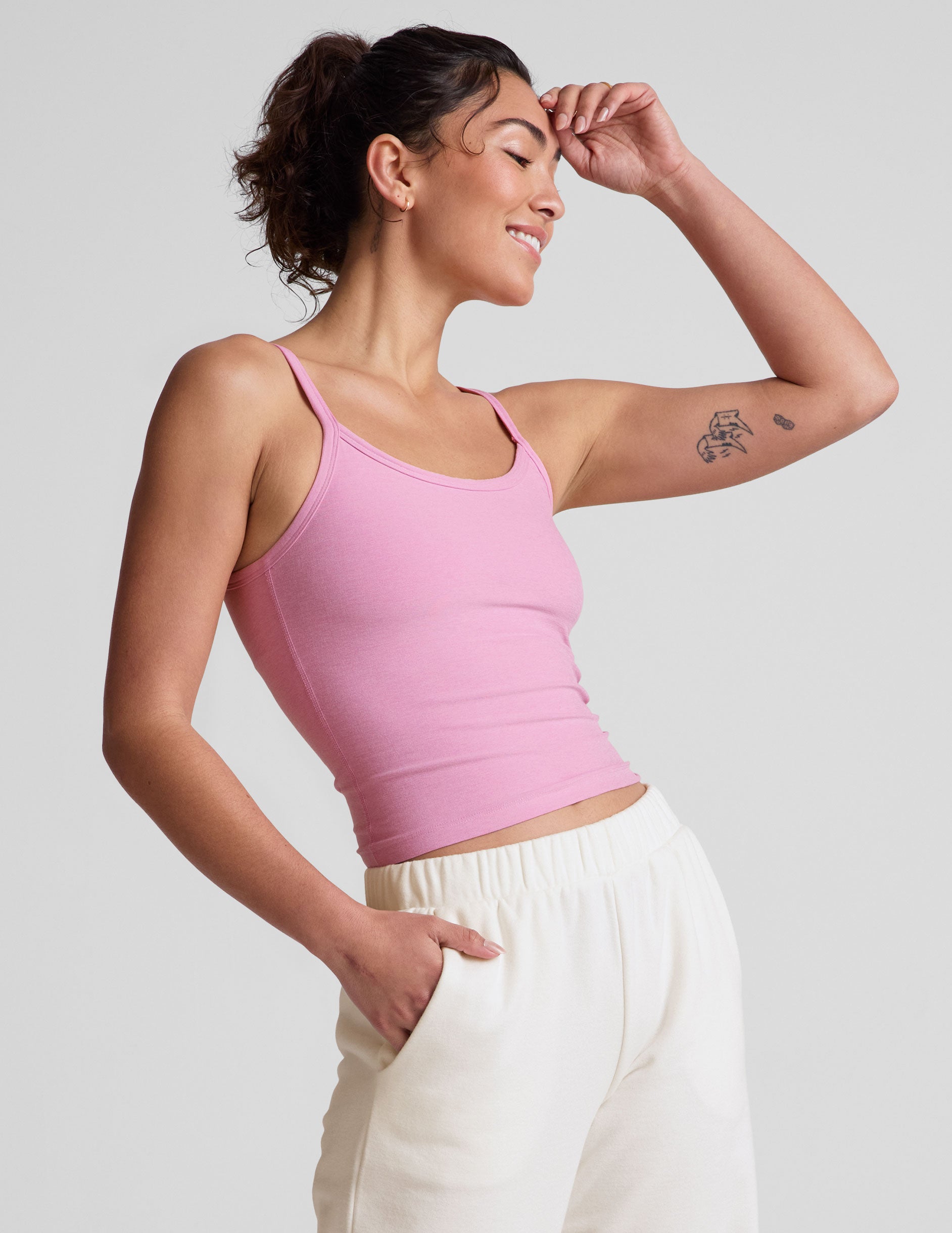 pink waist length tank with adjustable spaghetti straps. 
