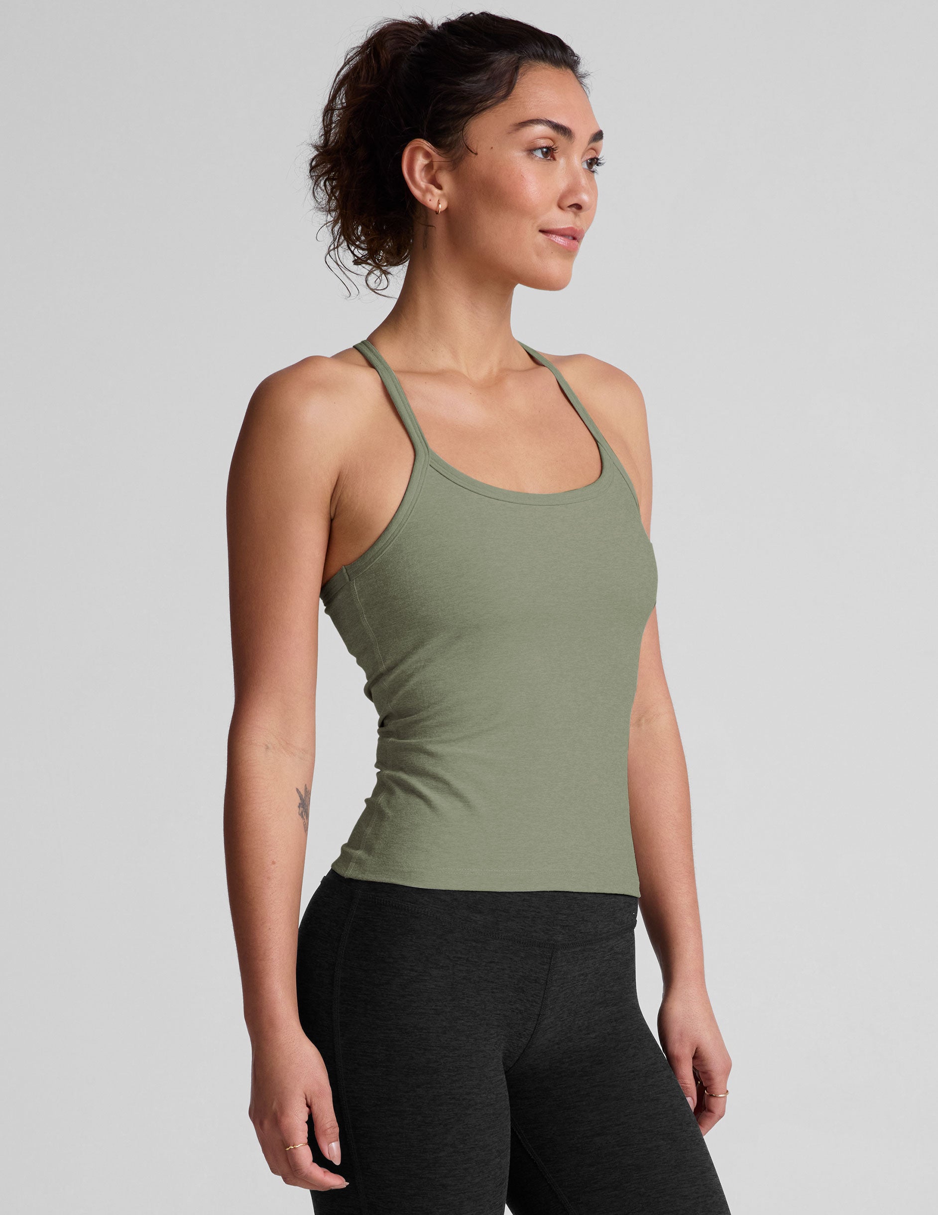 green midway length racerback tank top with adjustable thin straps.