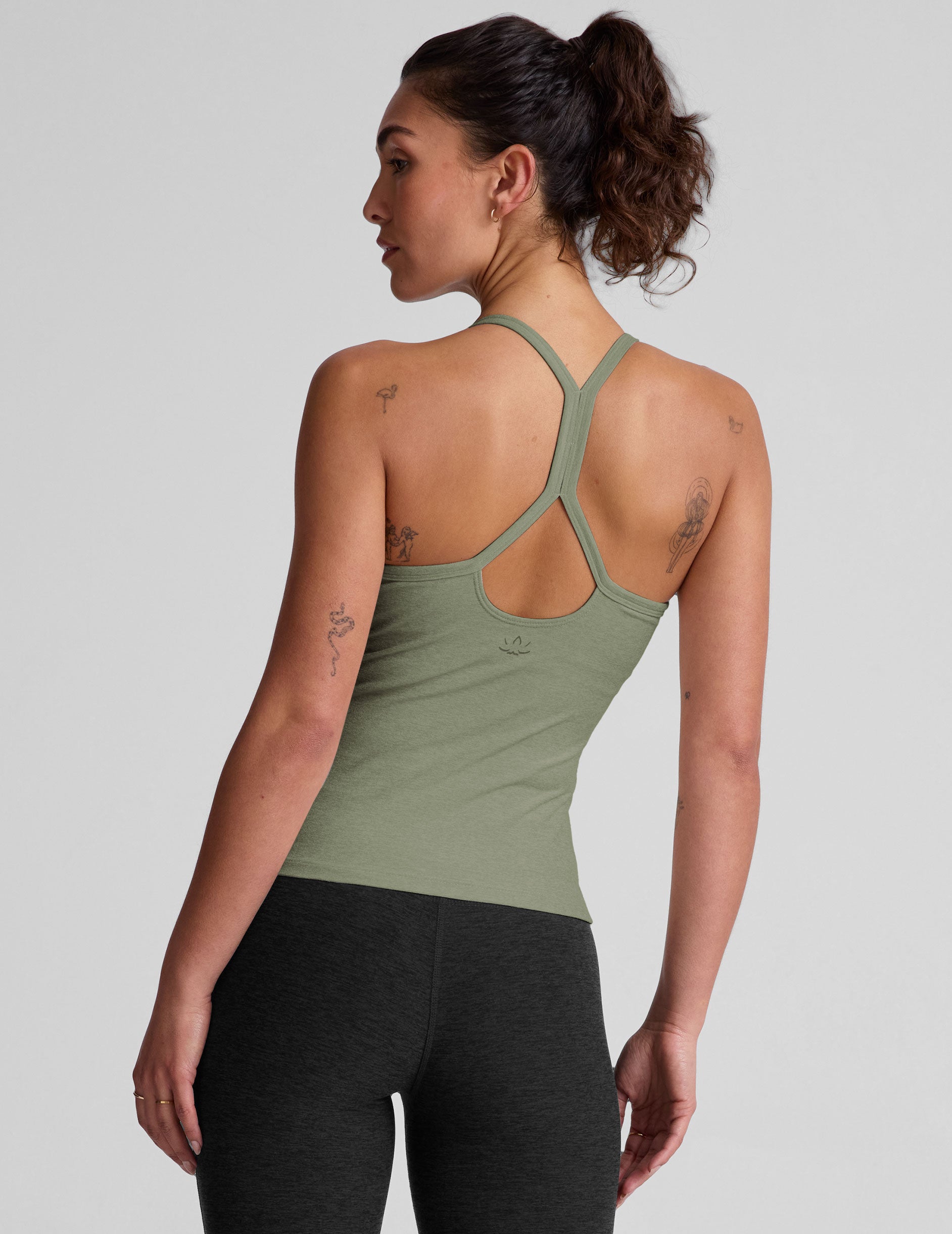 green midway length racerback tank top with adjustable thin straps.