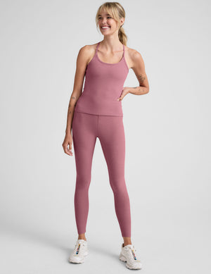 pink waist length racerback tank with slim straps. 