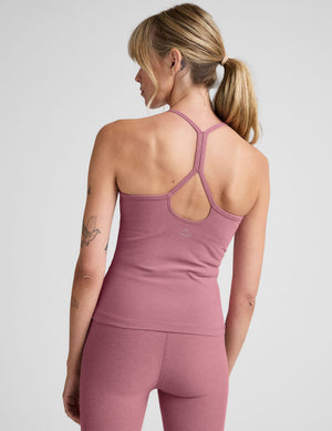 pink waist length racerback tank with slim straps. 