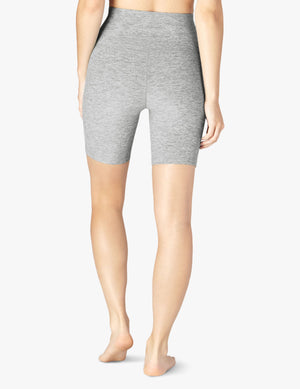 Rear view of the marled gray Spacedye High Waisted Biker Short showing the snug, mid-thigh fit on a standing model.
