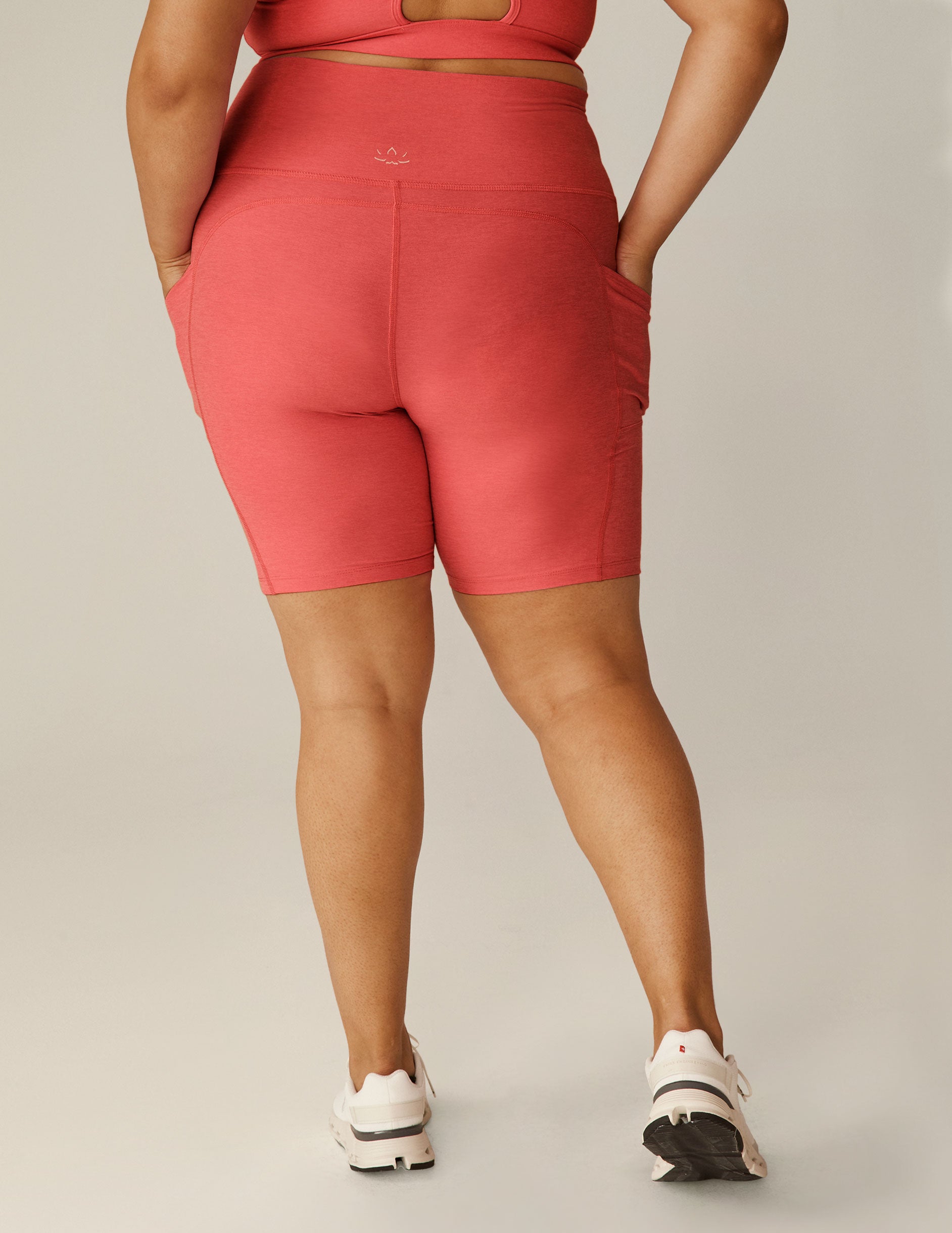 plus size model is wearing pink biker short