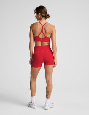 Woman in red racerback bra and 3