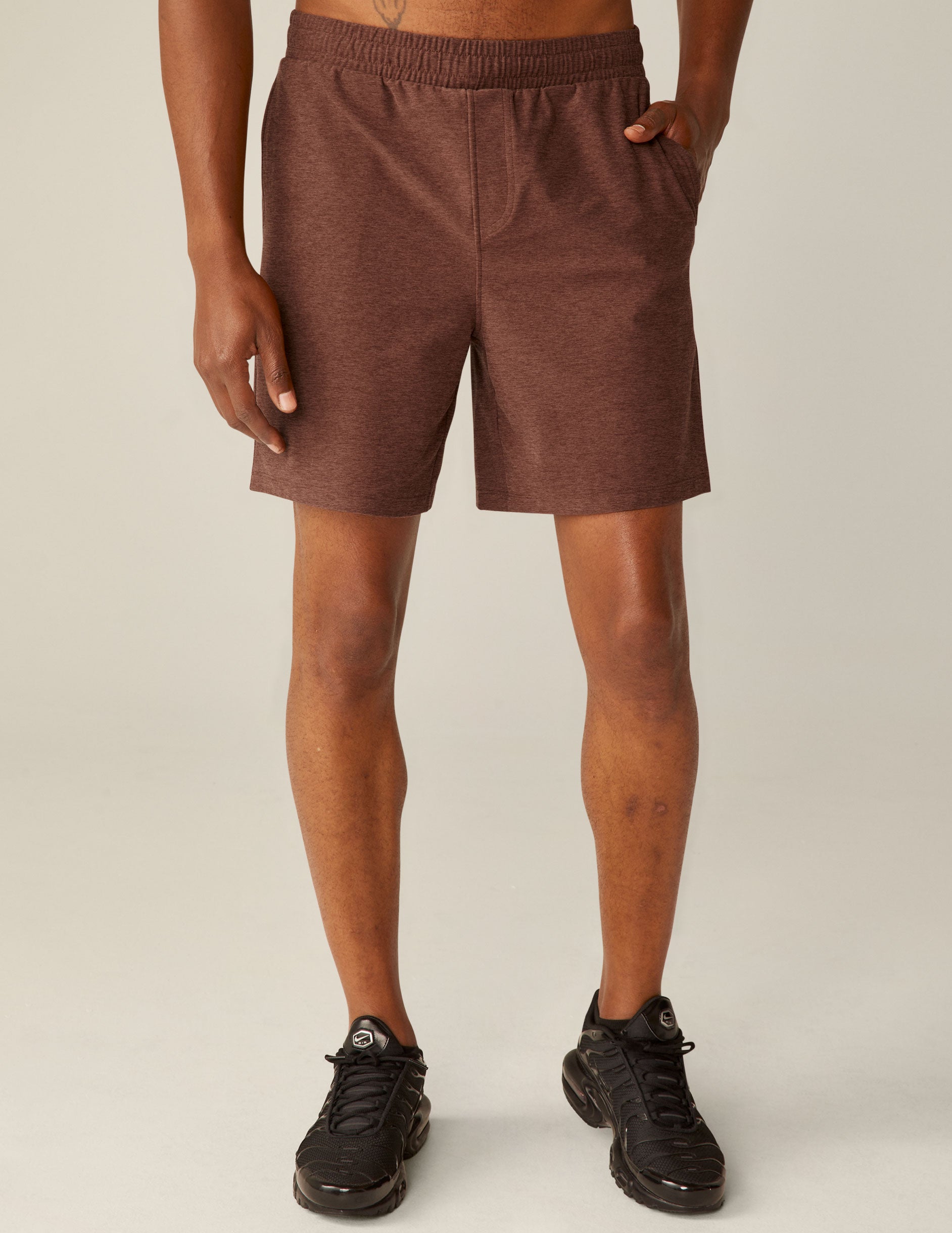 brown men's shorts with front pockets and a back pocket. 