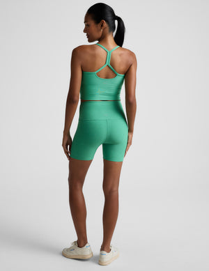 Rear view of a woman in green Spacedye Keep Pace 5