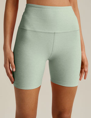 green high-waisted biker shorts with a 5