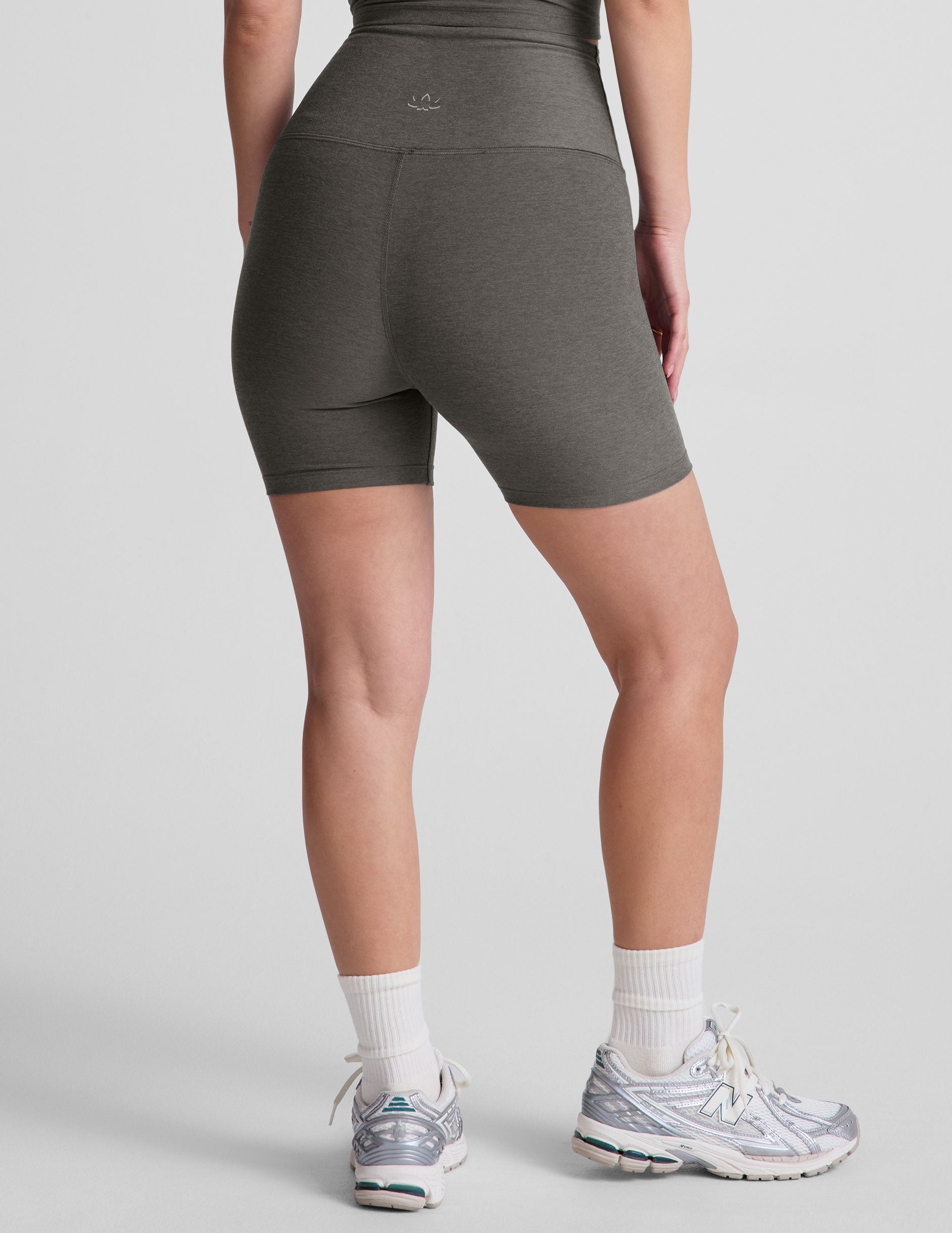 gray high-waisted biker shorts with a 5" inseam. 