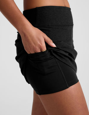 black a-line skirt with built-in shorts with pockets. 