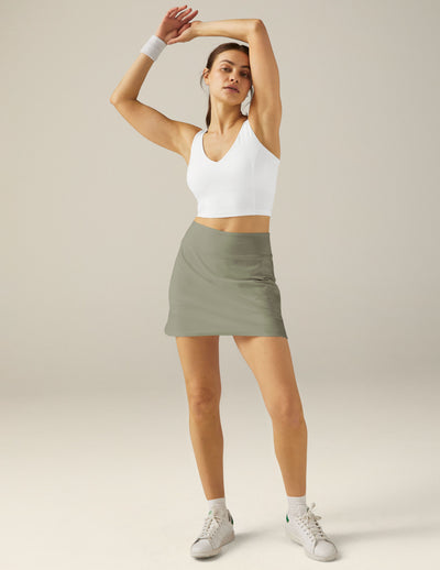 green mini skirt with interior shorts with pockets