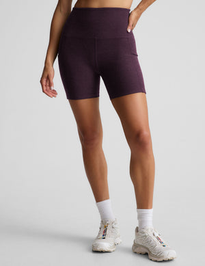 model is wearing a purple sports bra and purple 5