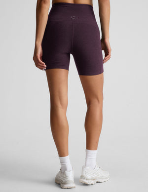 model is wearing a purple sports bra and purple 5