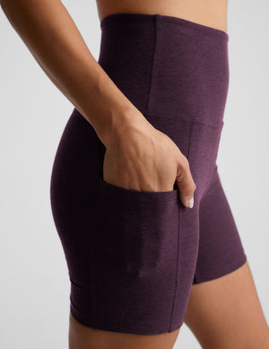 model is wearing a purple sports bra and purple 5