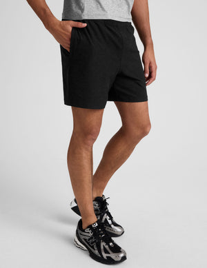 black men's spacedye shorts against a plain background. 