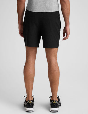 black men's spacedye shorts against a plain background. 