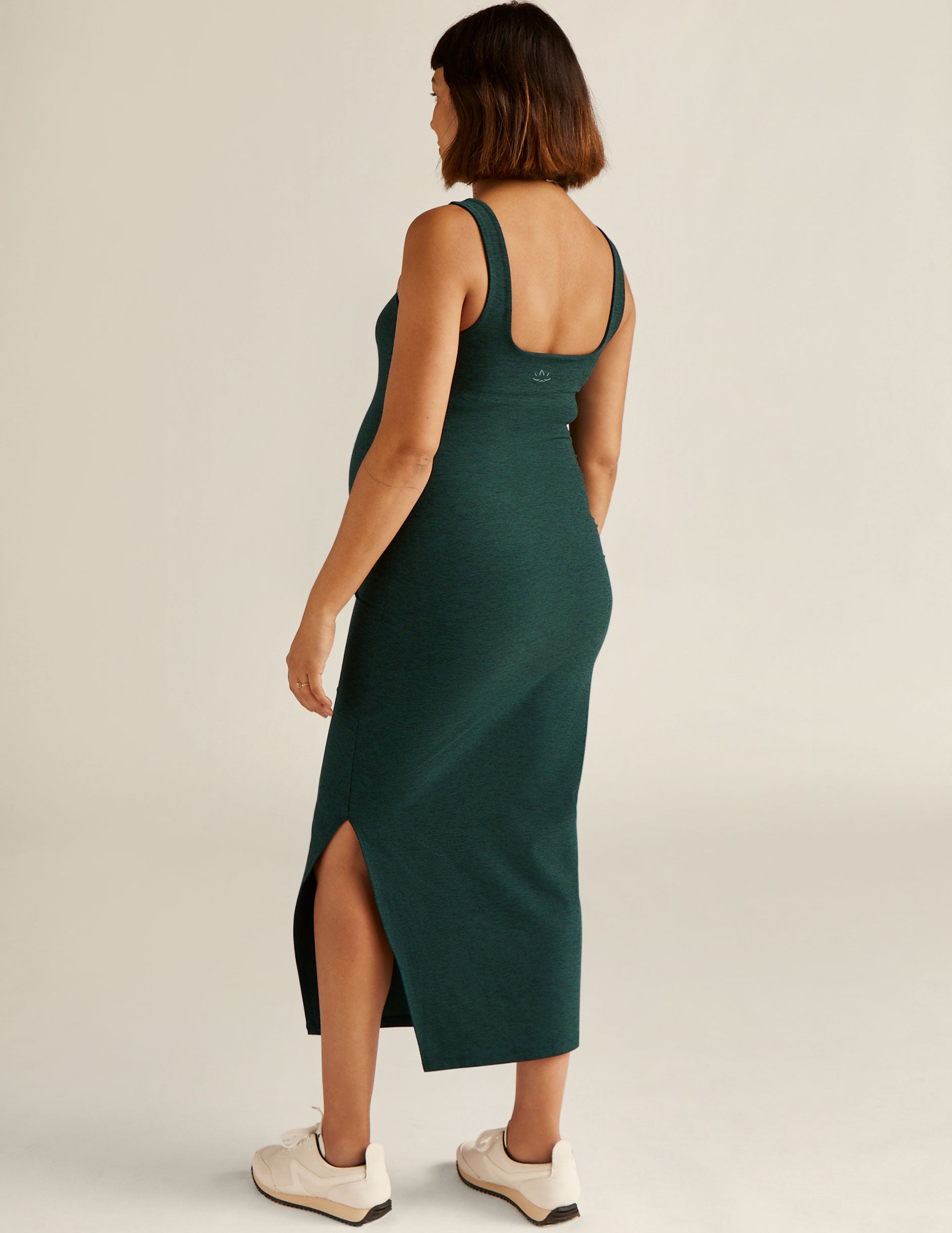 green maternity dress with a front side slit. 