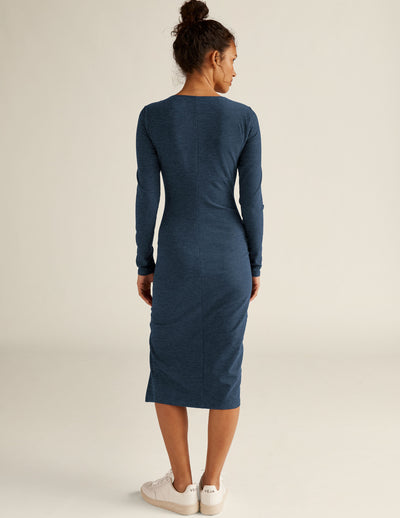 blue long sleeve square neck midi dress with a front side slit. 