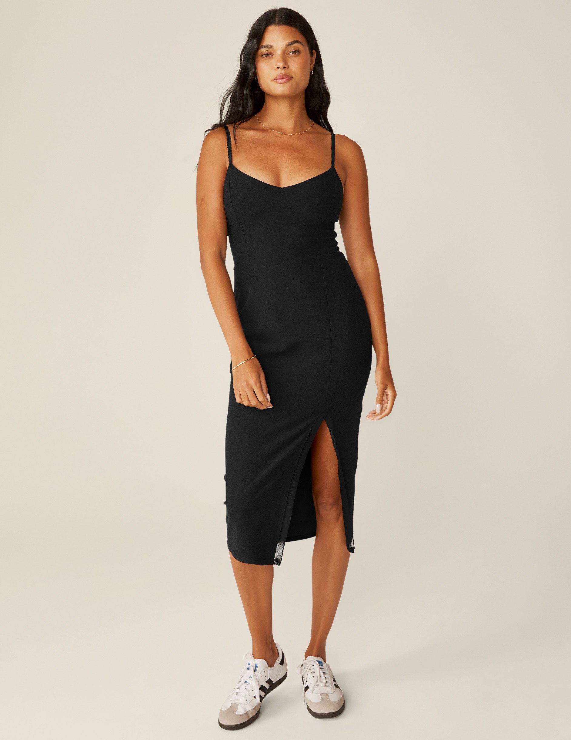 black spaghetti strap midi dress with a front side slit and lace trim. 
