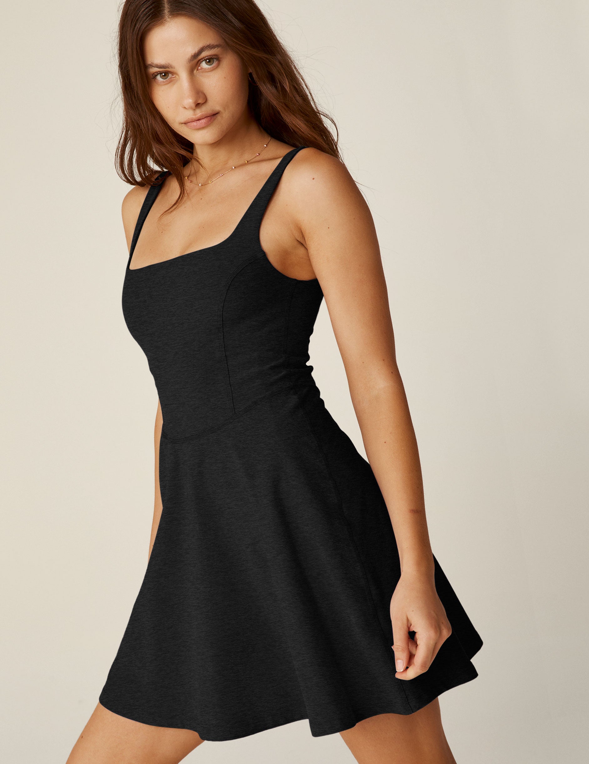 black mini spacedye dress with a squared neckline and built-in shorts with pockets. 