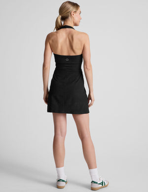 black mini style dress with an over the neck halter strap and a built-in bodysuit with pockets. 