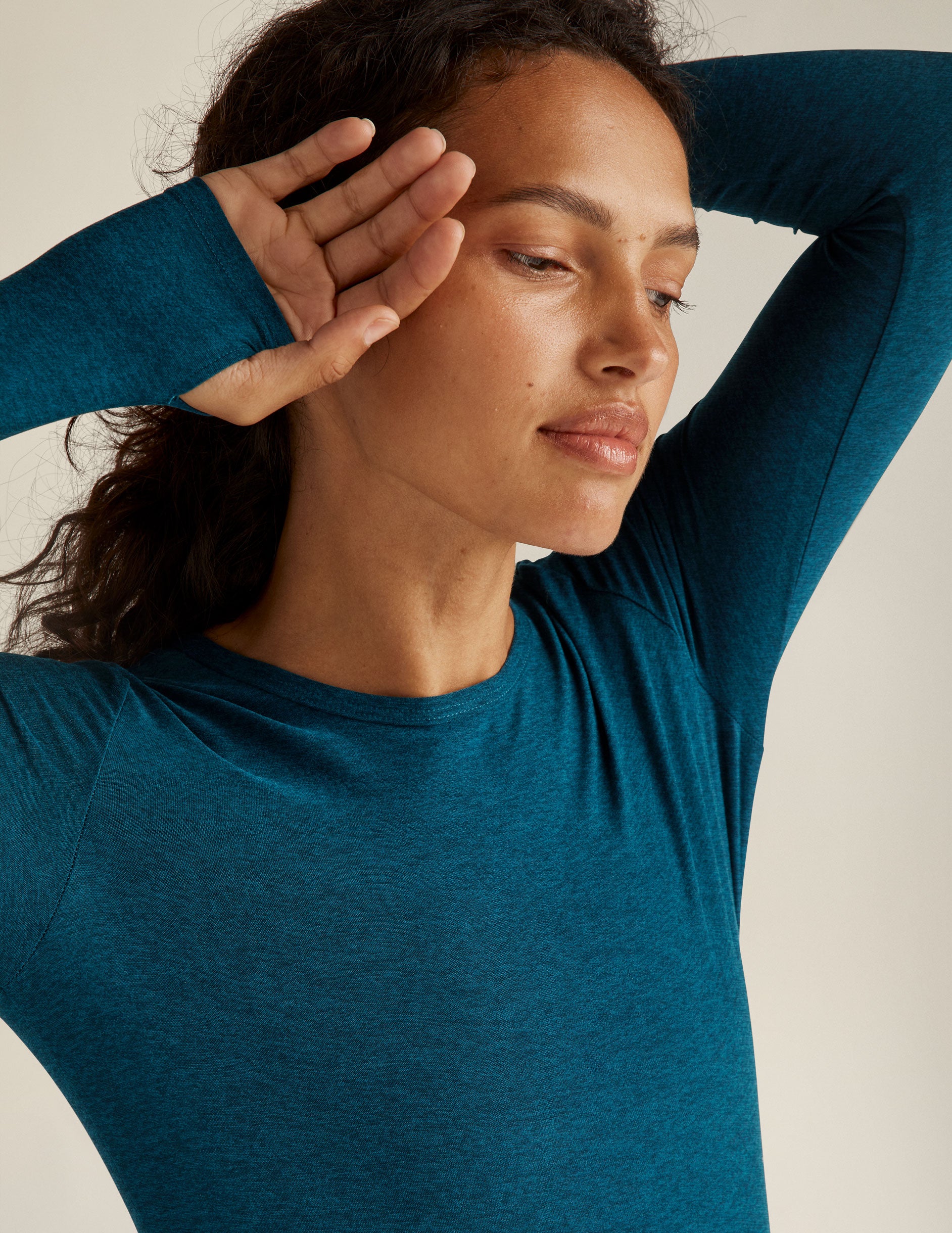 blue long sleeve top with thumb holes. 