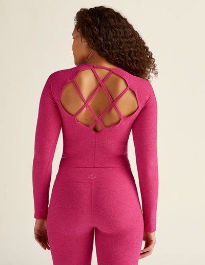 red long sleeve pullover top with back strappy detail