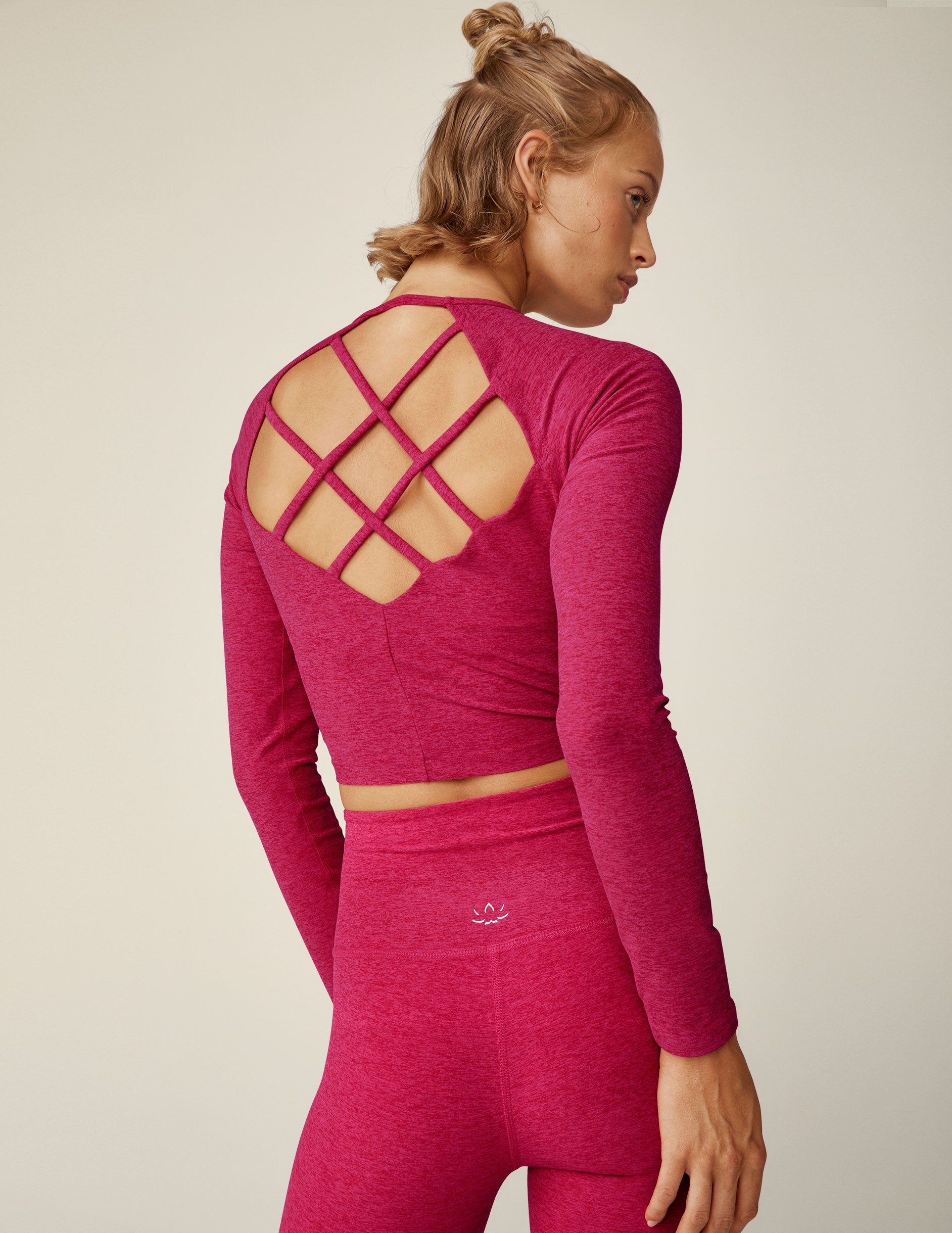 red long sleeve pullover top with back strappy detail