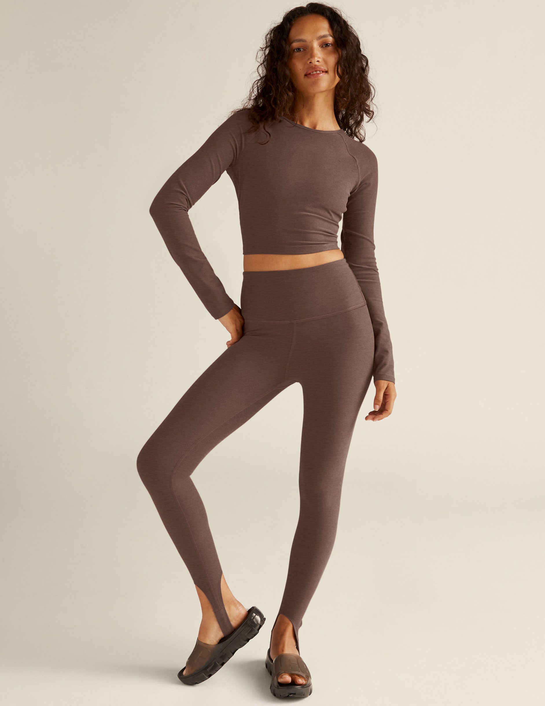 brown long sleeve cropped pullover with an open strappy back detail. 