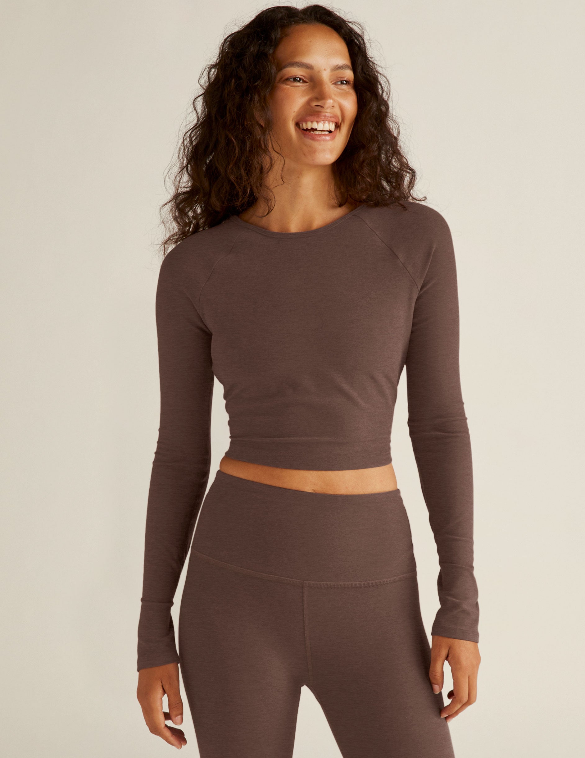 brown long sleeve cropped pullover with an open strappy back detail. 