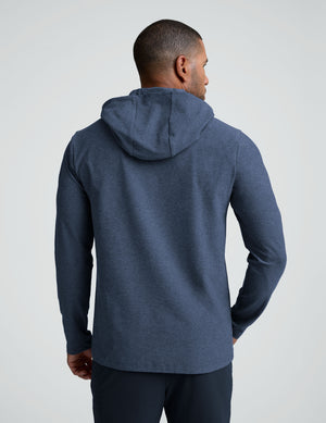man wearing a blue hoodie sweatshirt. 