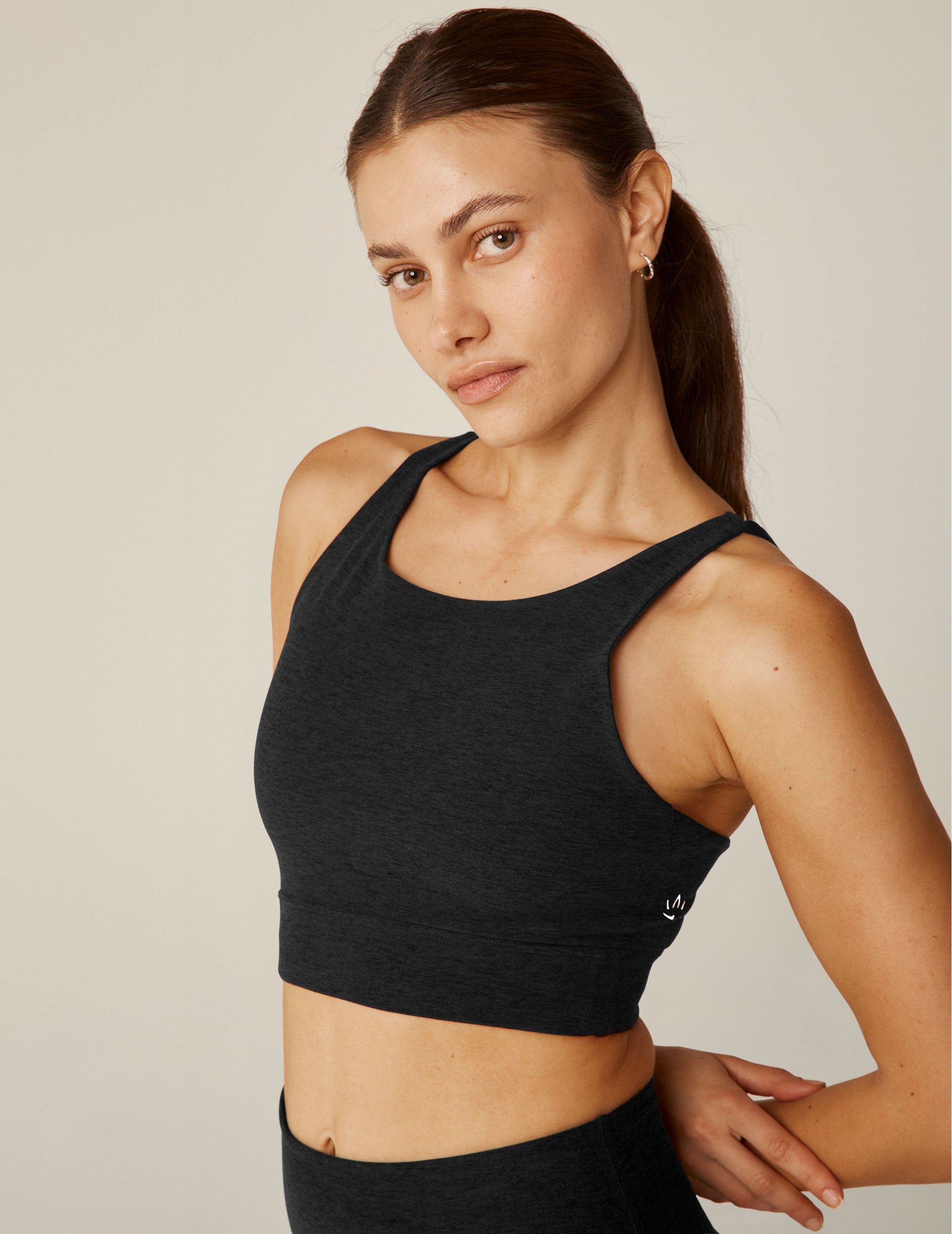 black bra top with an open back, strap detail.