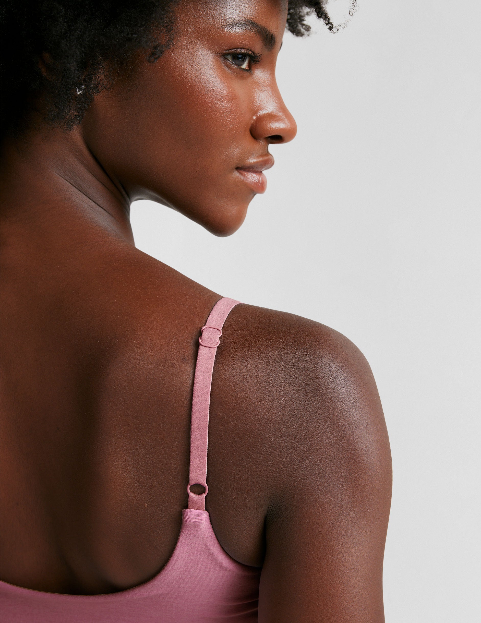 pink bra with adjustable straps and shirred detailing on the side. 