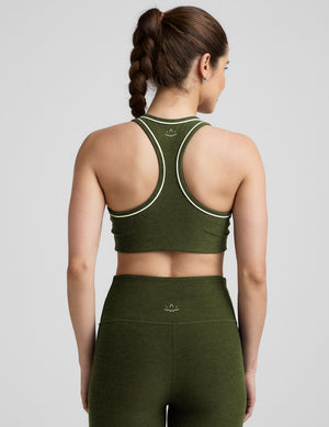 green racerback bra with white contrast trim. 