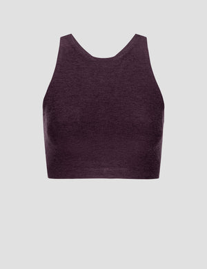 purple high-neck racerback bra on a light gray background. 