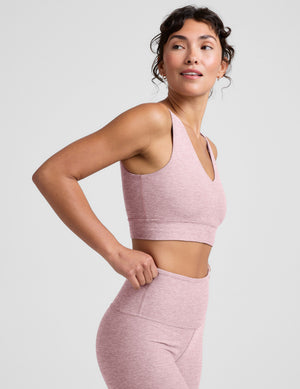 pink long line style bra with a front and back v-neck. 