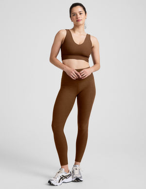 brown long line style bra with a v-neck in back and front. 
