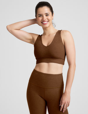 brown long line style bra with a v-neck in back and front. 