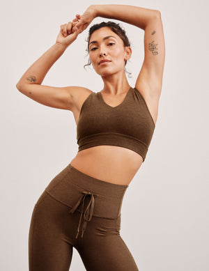 brown long line style bra with a v-neck in back and front. 