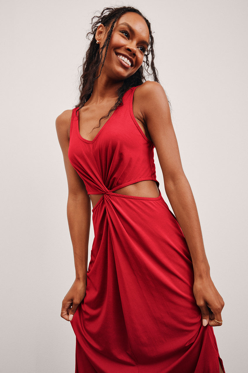 red maxi length dress with cutouts at waist. 
