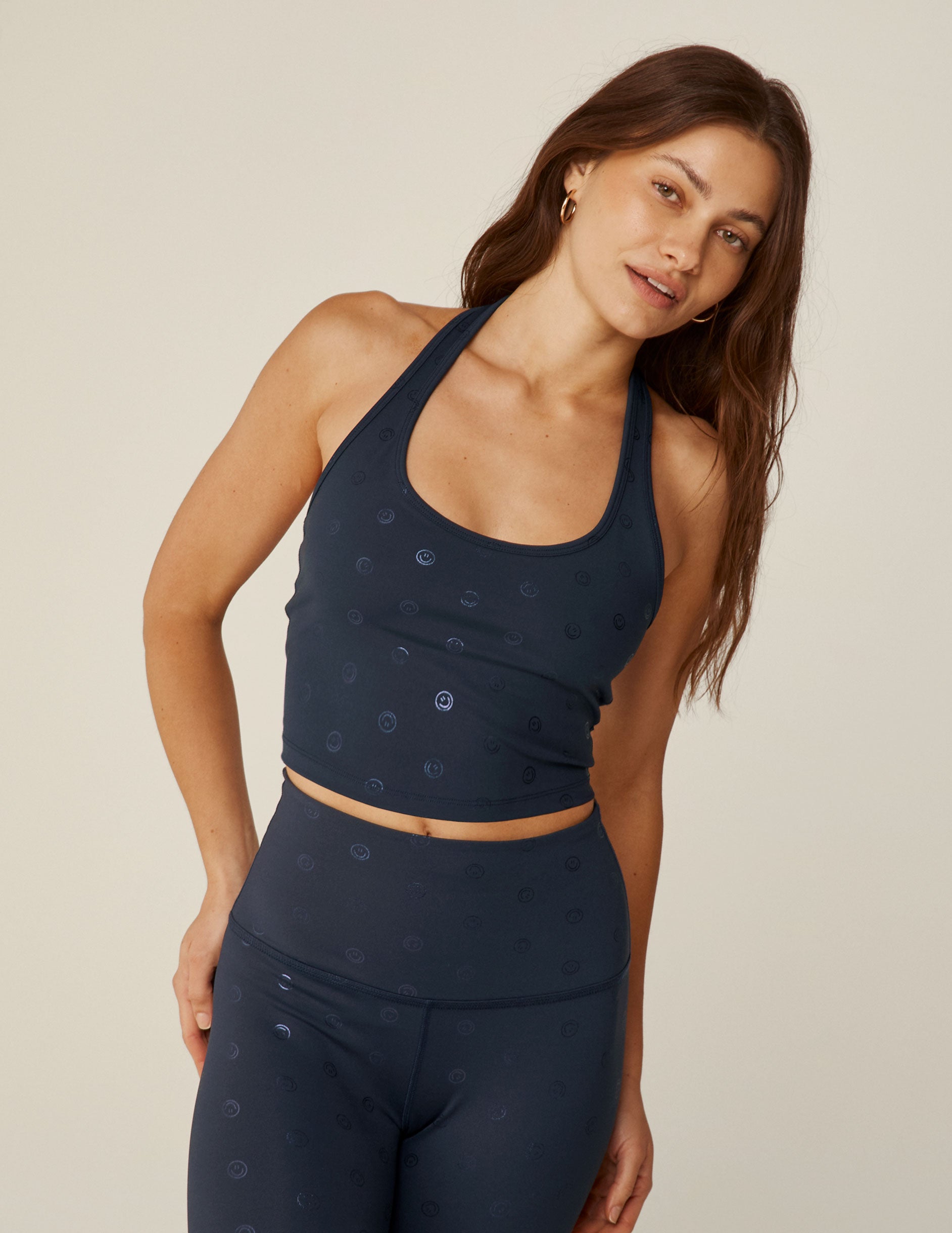 blue powershine halter cropped tank top with a happy face print. 