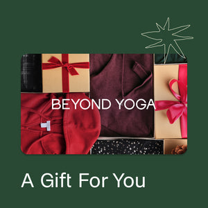 Gift card with 'Beyond Yoga' branding and various gift items on a green background.