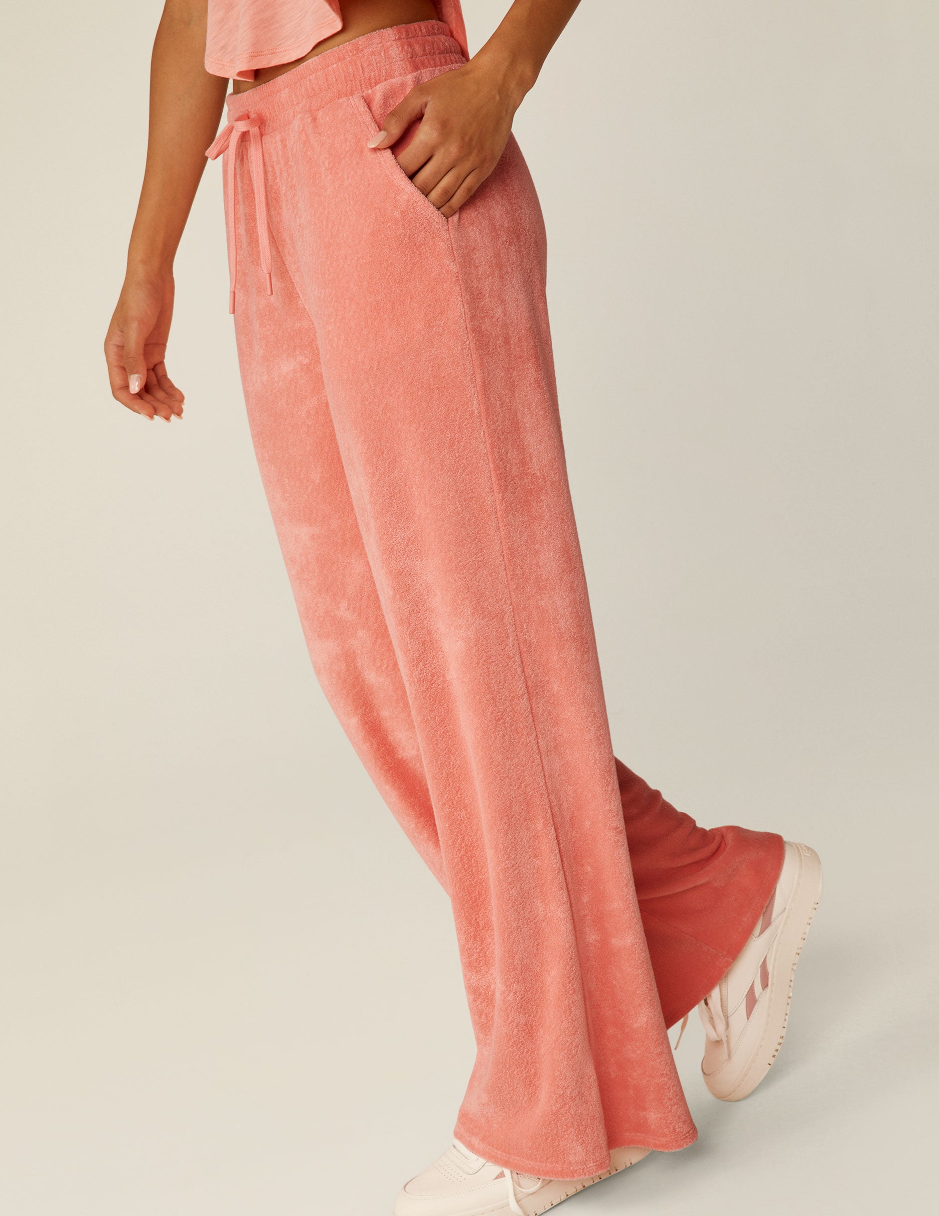 pink terry fabric pants with a drawstring at waistband.