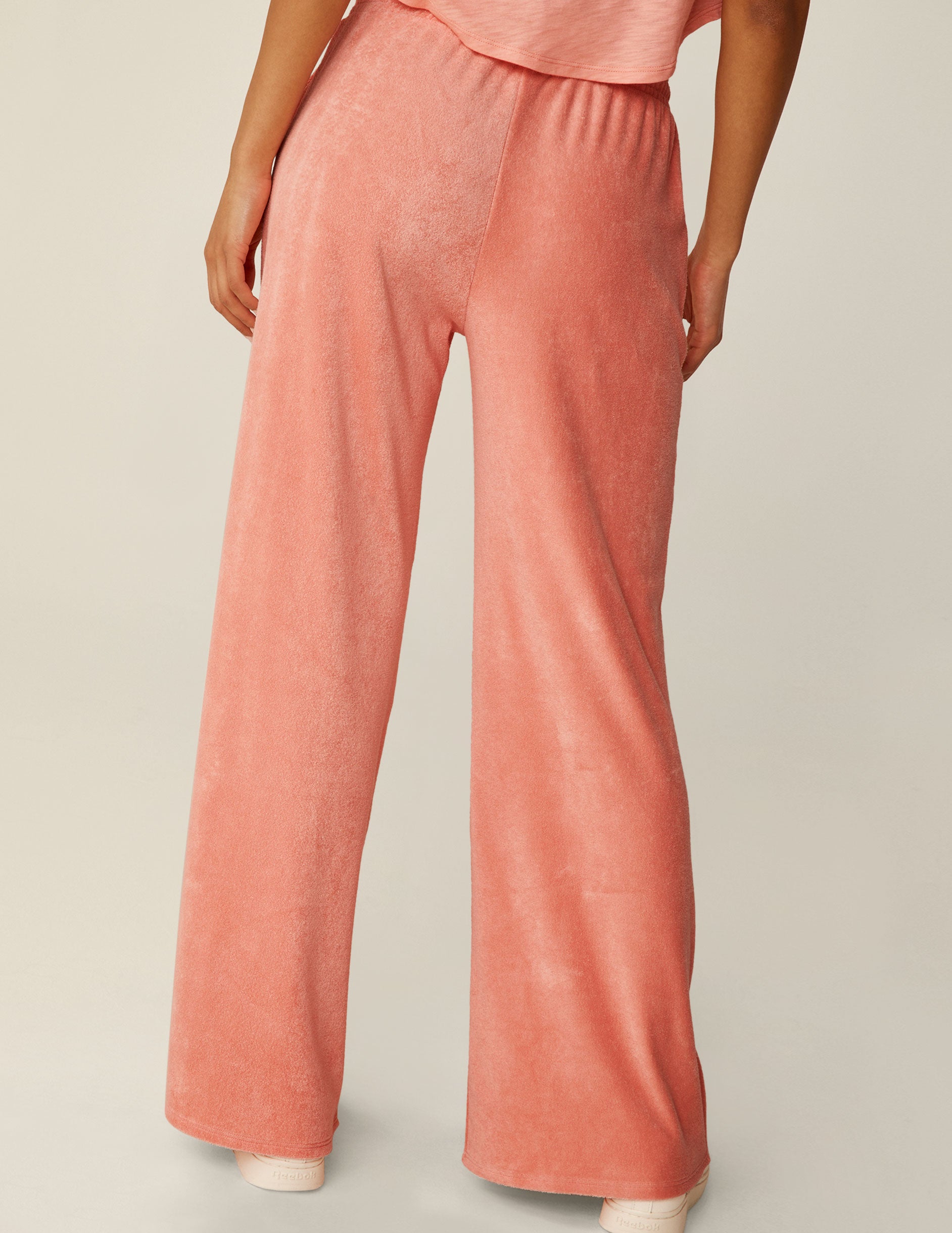 pink terry fabric pants with a drawstring at waistband.