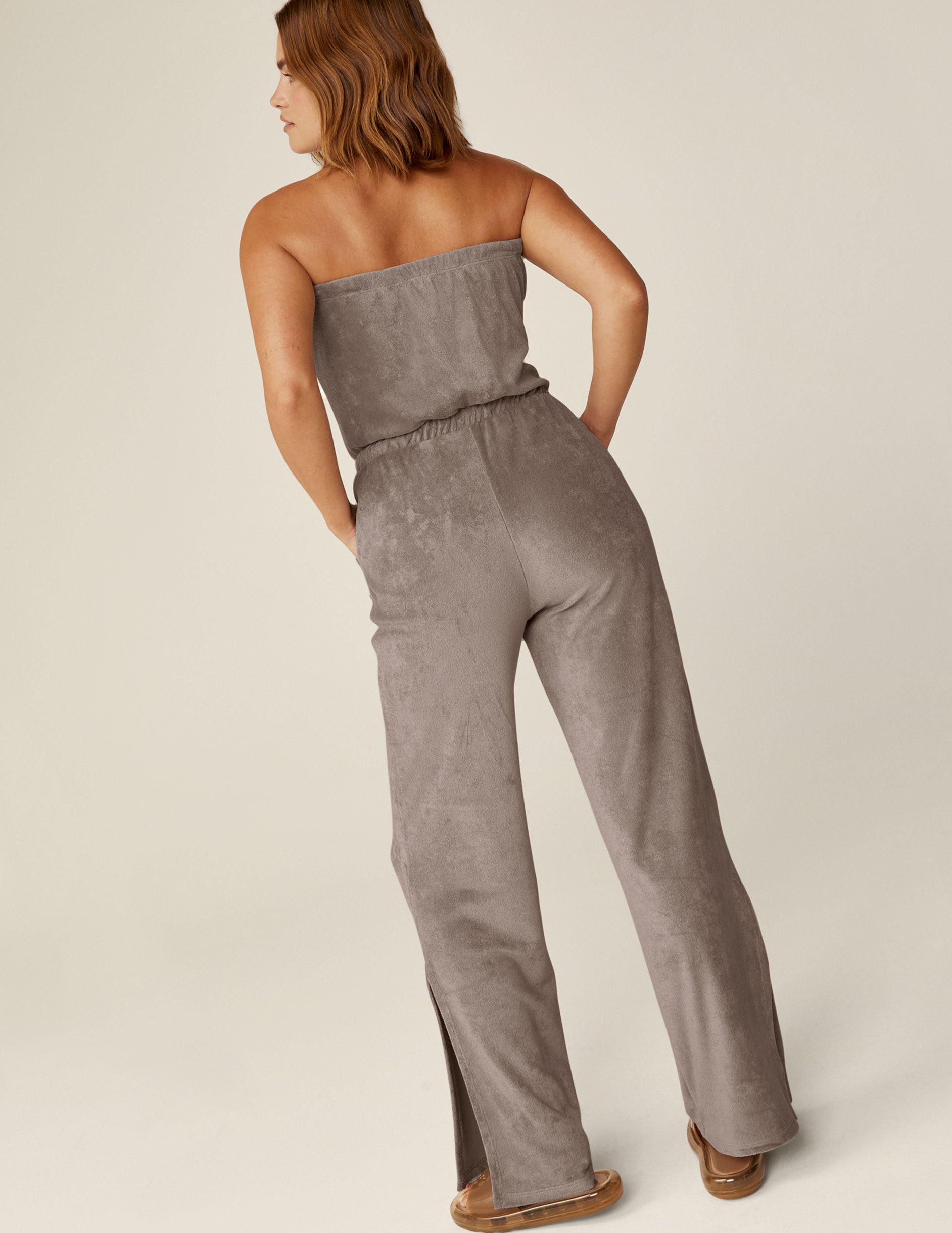 brown strapless terry jumpsuit with a drawstring at the waistband. 