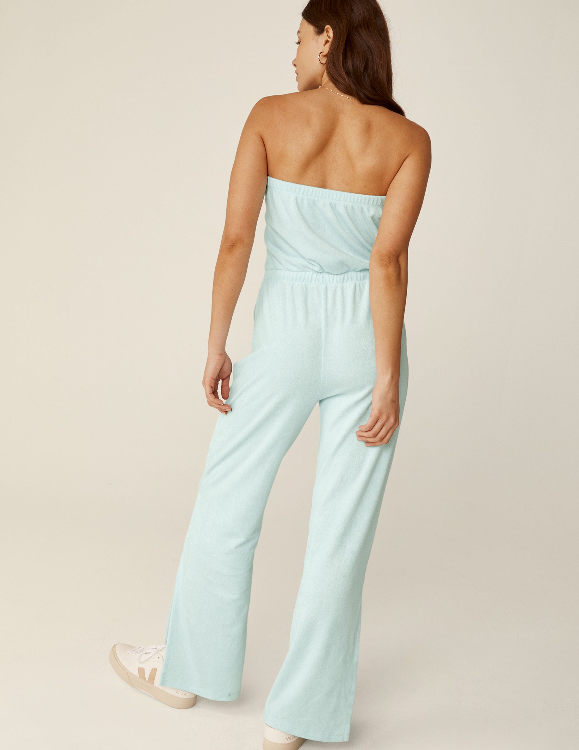 blue strapless terry fabric midi jumpsuit with a drawstring at the waistband. 
