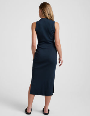blue midi length ribbed dress with a side slit and mock neckline. 