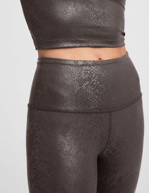 brown viper printed high-waisted midi length leggings. 