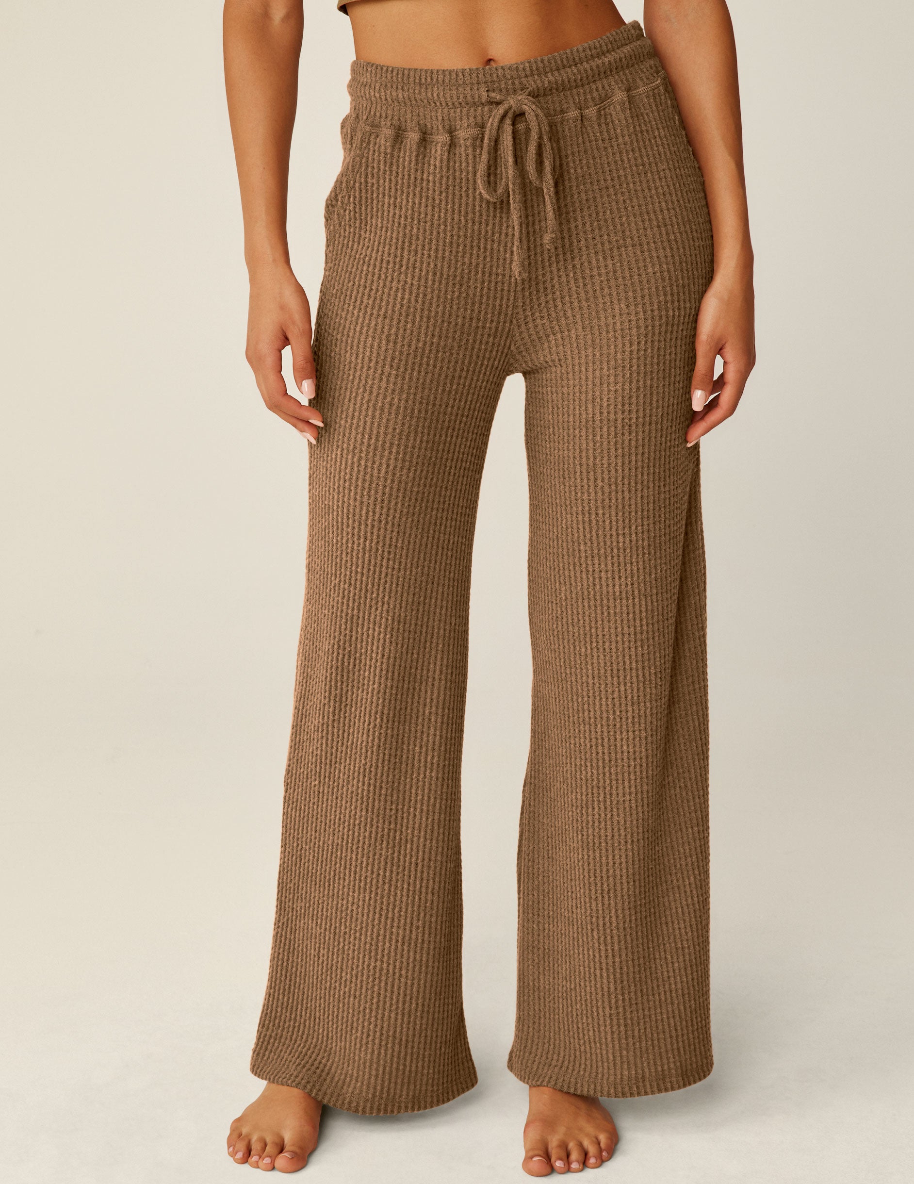 brown waffle knit pants with drawstring at waistband. 