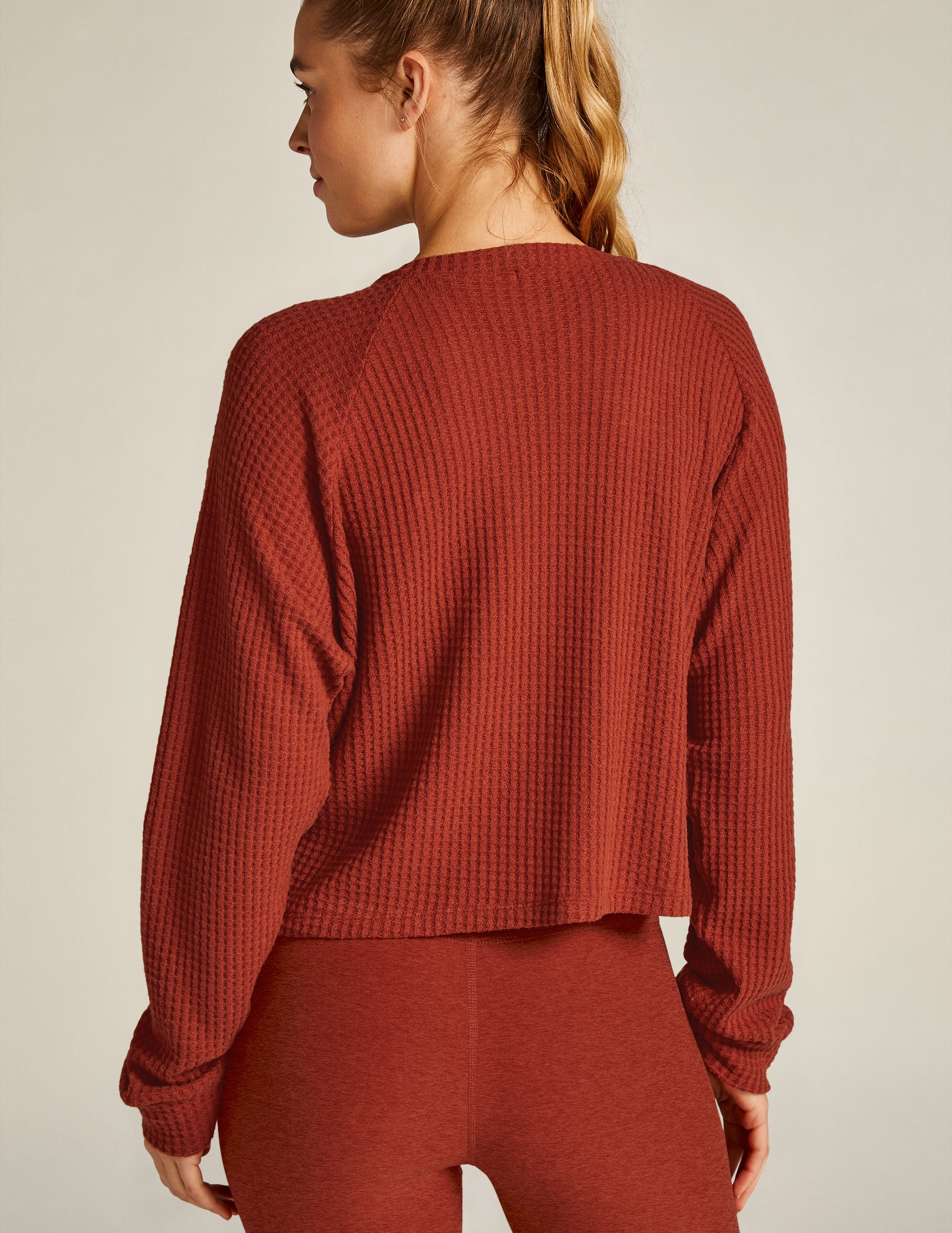 red v-neck long sleeve pullover. 
