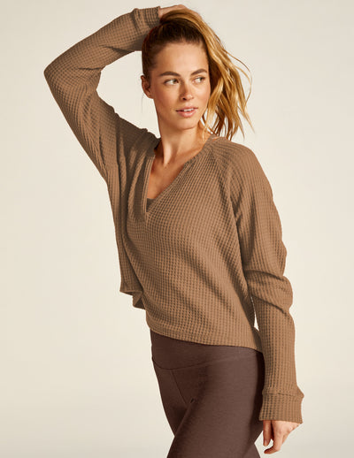brown v-neck long sleeve pullover. 